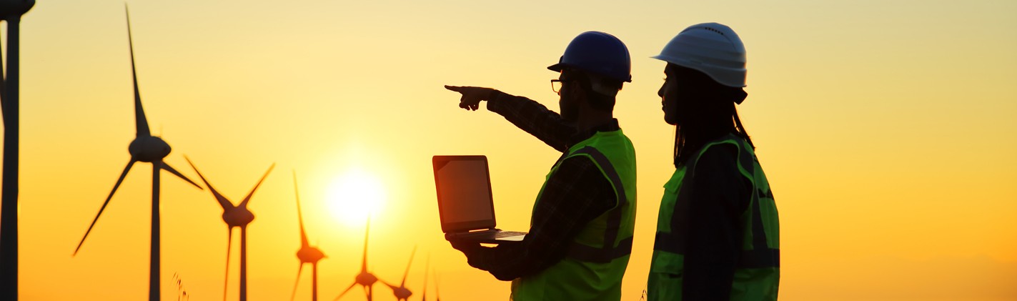 Workers in front of Wind Turbines